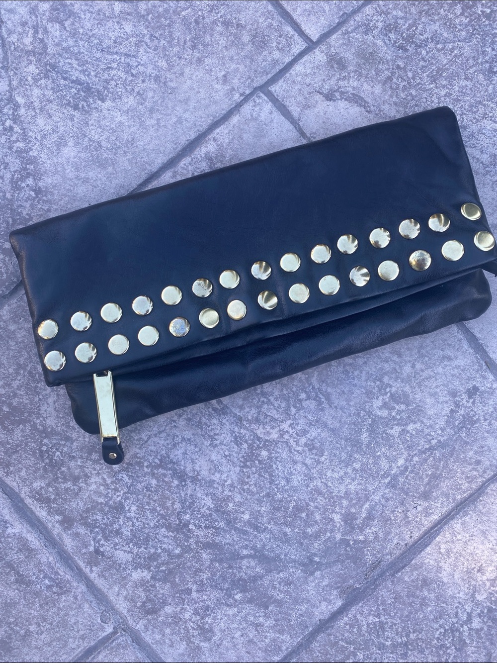 Steve Madden 
Black Fold-Over Clutch with Gold Stud Trim
